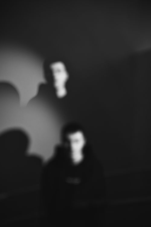 Free Abstract black and white portrait with shadowy figures creating a mysterious atmosphere. Stock Photo