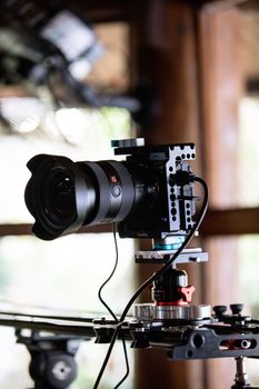 High-end video camera setup with slider rig for professional filming.