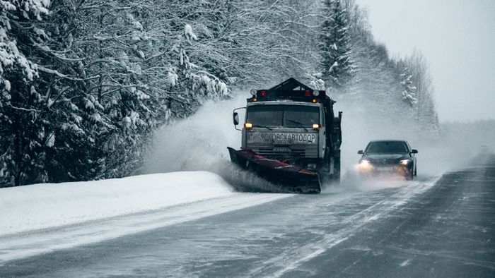 Snowplow clearing a snowy road