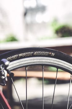 Detailed view of a racing bicycle tire with focus on the Grand Prix 4000 brand.