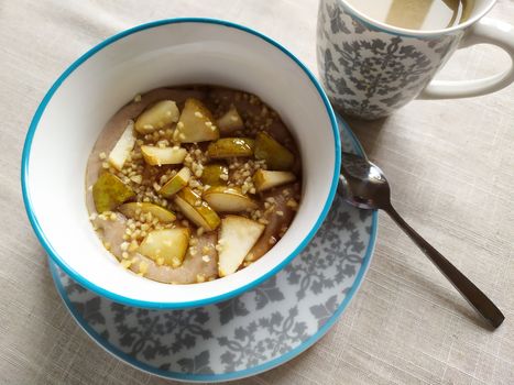 Delicious homemade breakfast bowl with pears and buckwheat in Czechia.