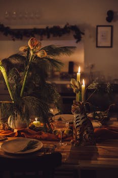 Cozy candlelit dinner setting with a floral centerpiece and decorative elements.