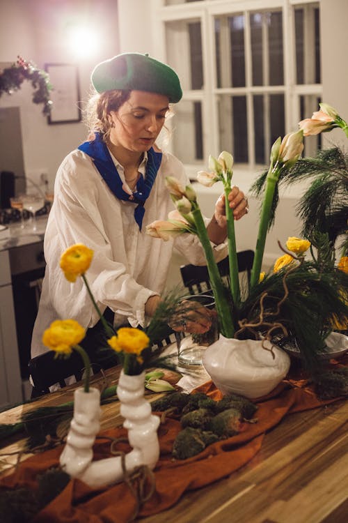 Woman Making a Flower Arrangement on the Table 