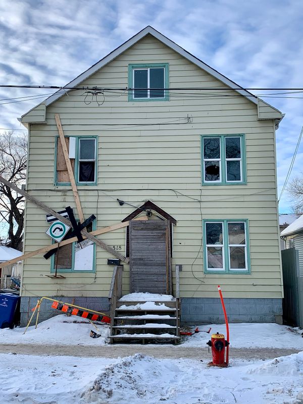 Boarded-up house representing foreclosure