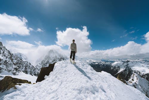 Free Person Standing on Slope Glacier Mountain Stock Photo