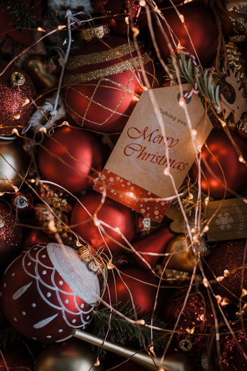 A Close-Up Shot of Christmas Baubles and Fairy Lights