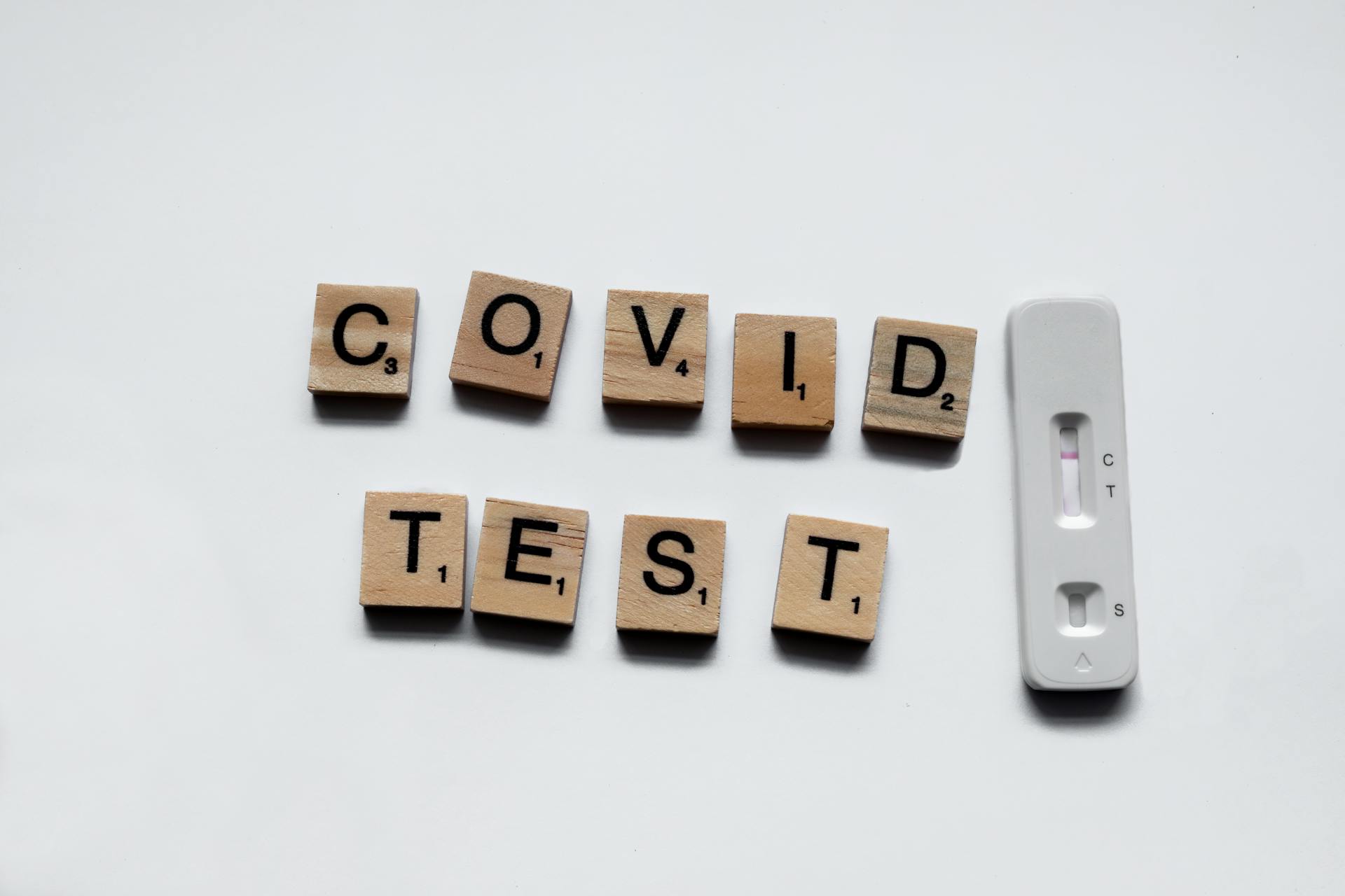 Sign From Wooden Blocks Saying Covid Test