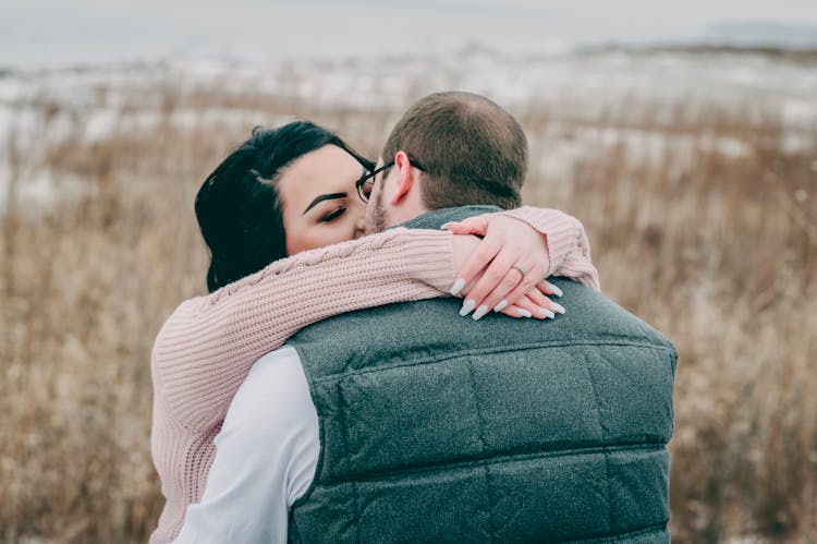 Man And Woman Kissing And Hugging