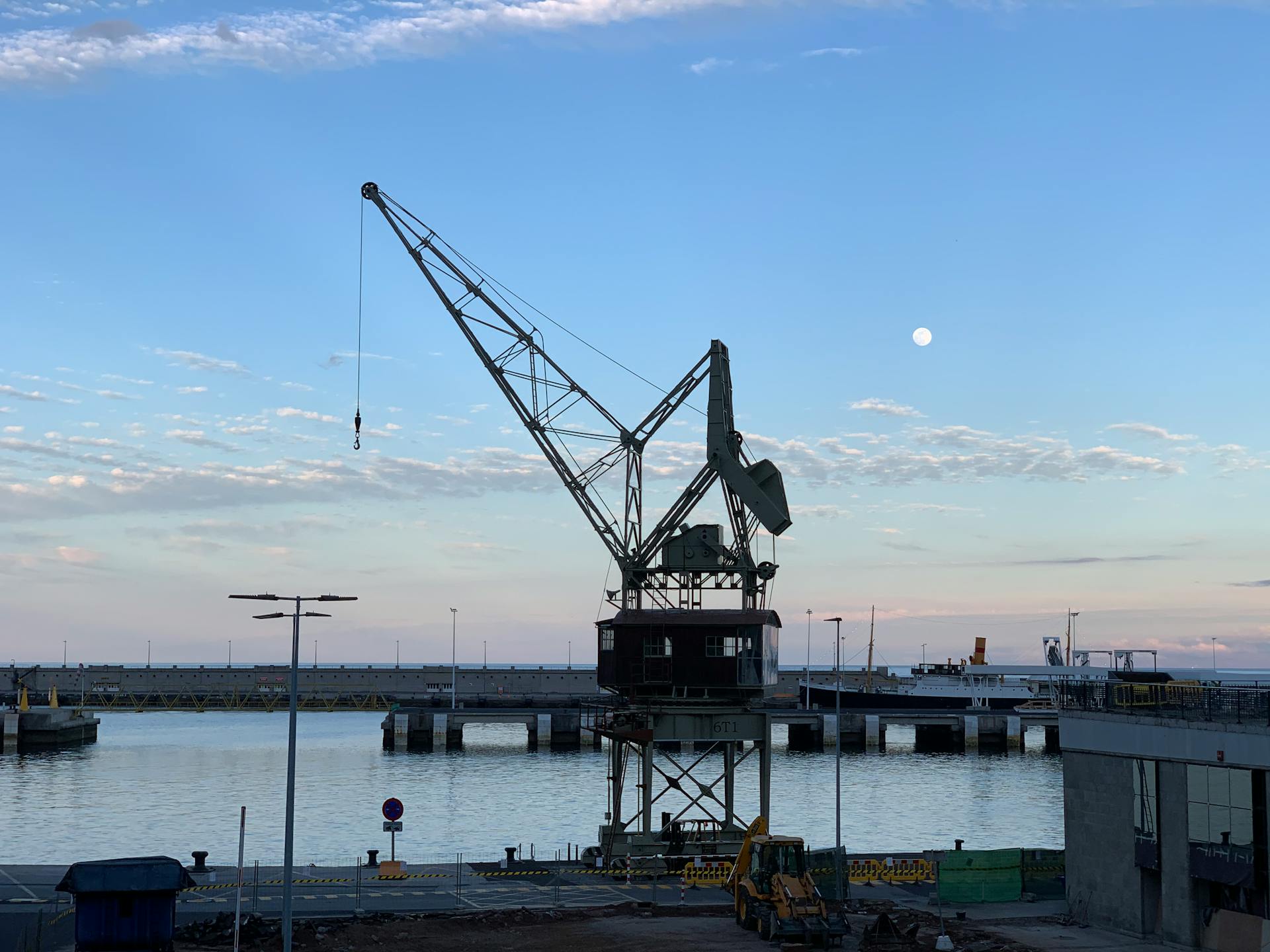 Tower Crane Near the Body of Water