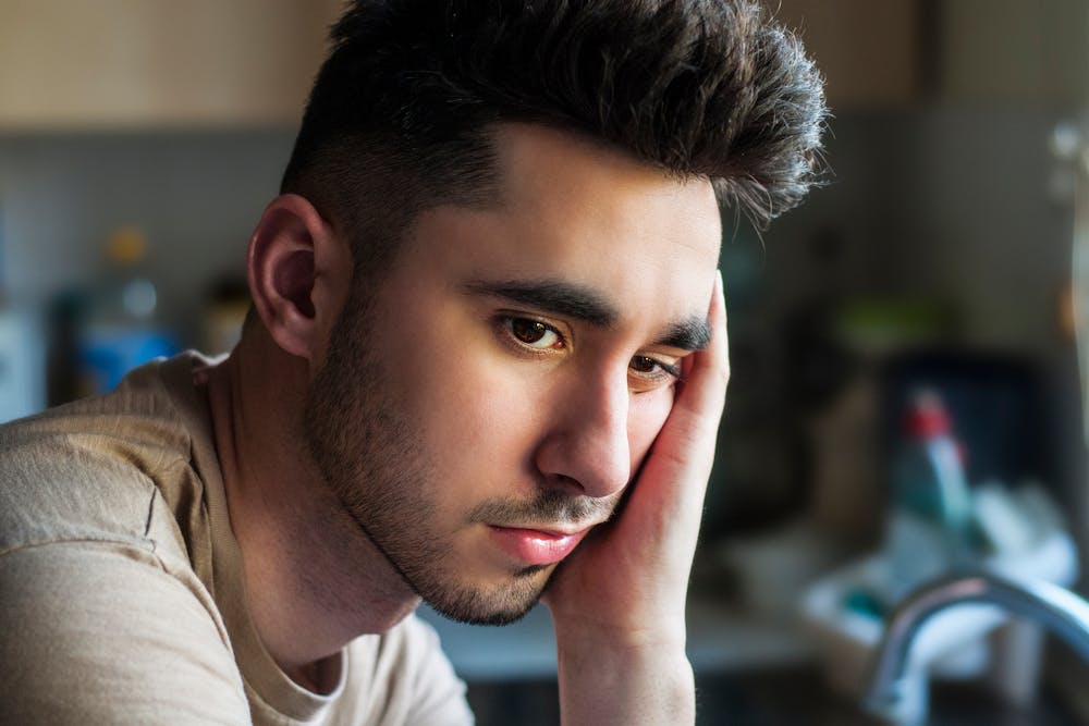A man thinking deeply about something. | Photo: Pexels