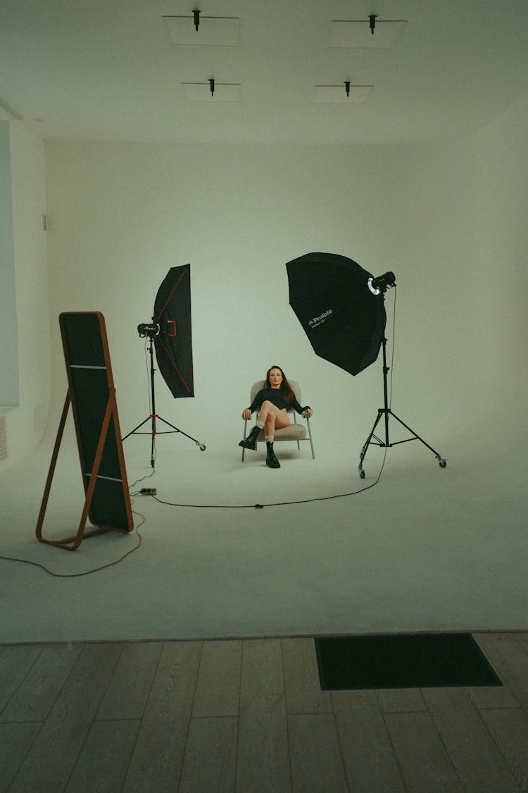 A Woman Sitting In A Studio