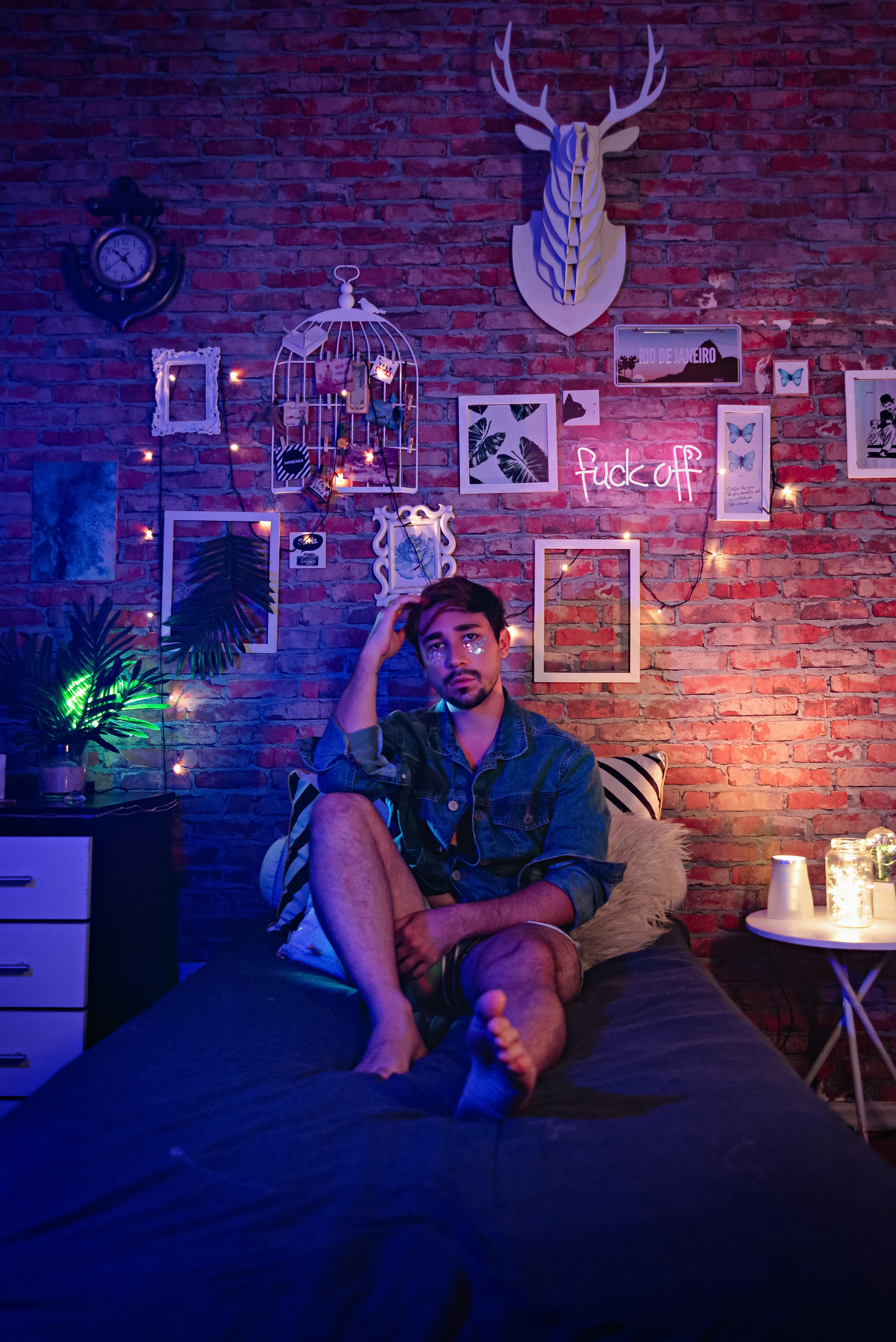 A Man Sitting on the Bed · Free Stock Photo