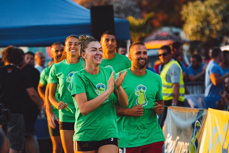 Men And Woman In Green T-shirts