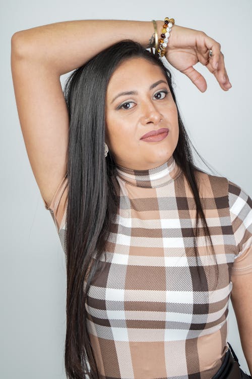 Woman Posing with Her Arm Raised 