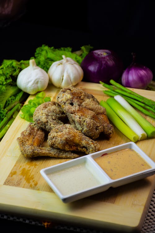 Fried Chicken on a Wooden Chopping Board