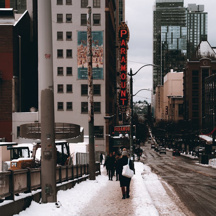 Free People Walking on Snow Covered Road Stock Photo