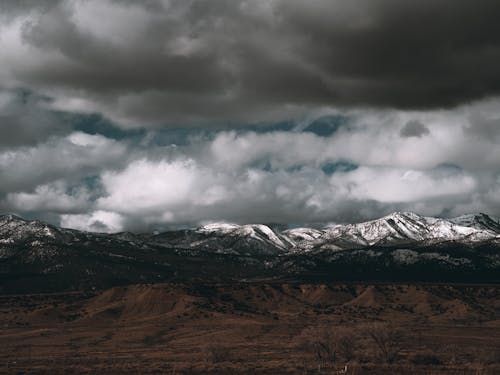 Free Snow Capped Mountains Under the Gray Clouds Stock Photo