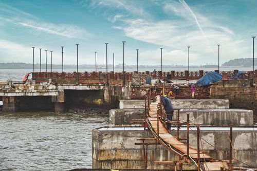Free Dock construction site in Goa, India with workers and blue sky. Stock Photo