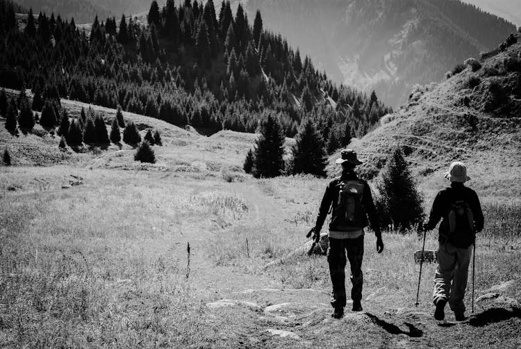 Black And White Photograph Of Hikers In Mountains