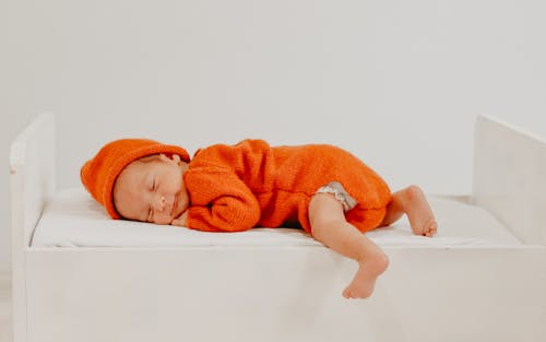 Free Newborn Sleeping on Bed Stock Photo