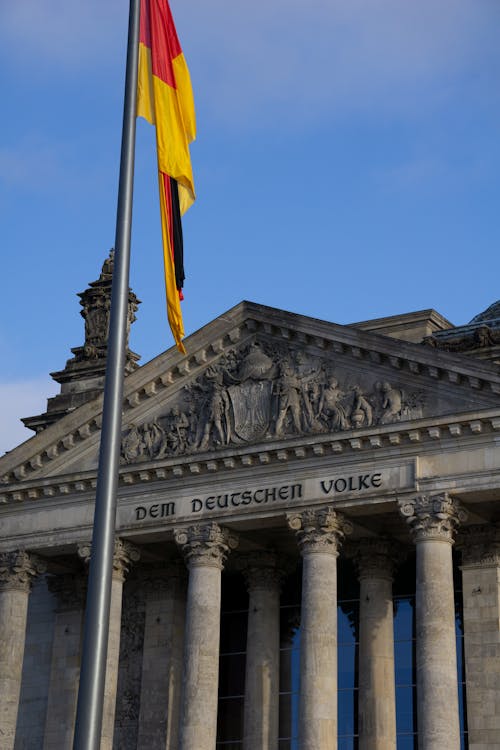 German Flag Outside the Historic Reichstag Parliament Building in Berlin, Germany