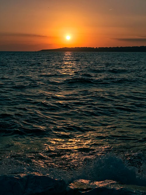 Scenic View of a Placid Sea during Sunset