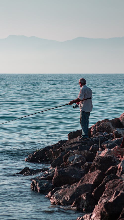 Man Fishing in a Sea 