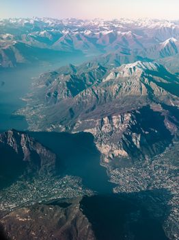 Stunning aerial view showcasing towering mountains, serene lakes, and sweeping landscapes.
