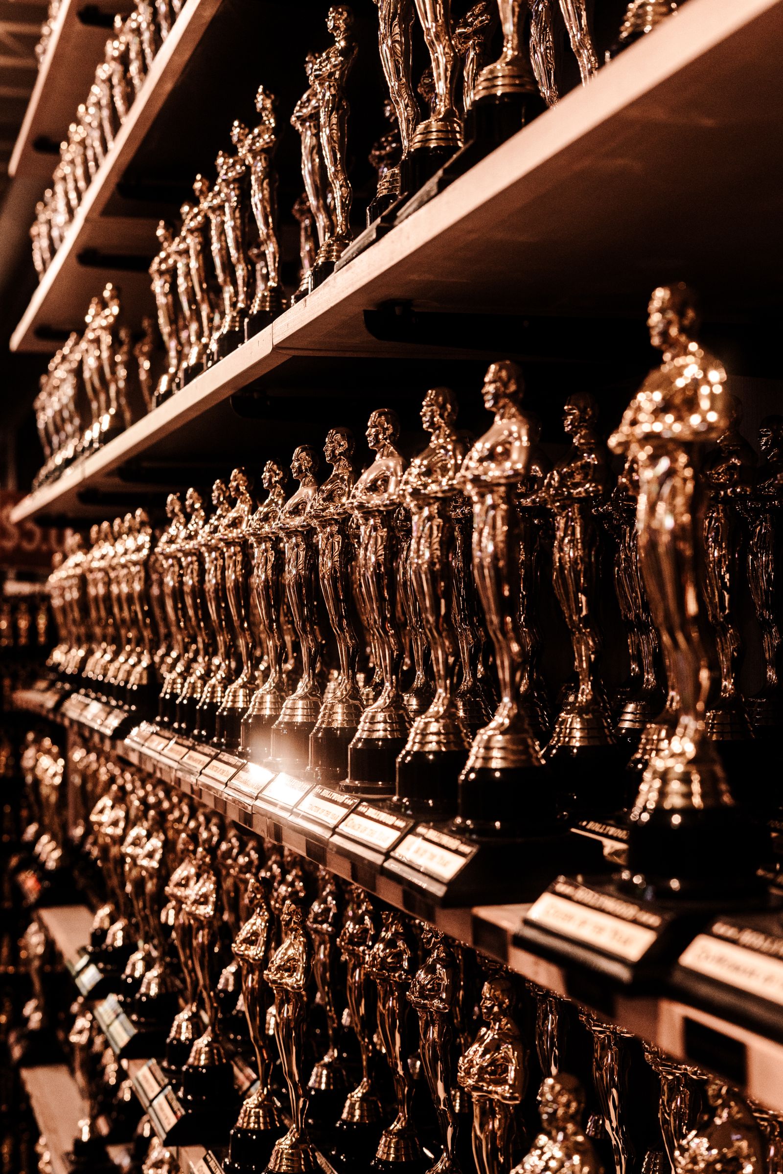 Row of silver trophies — the kind of custom award Roc 3D Printing produces for Rochester businesses