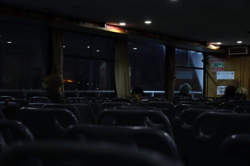 People Sitting in a Ferry at Night 