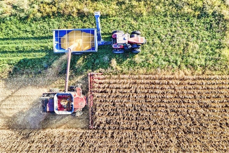 Aerial Photography Of Tractors On Field