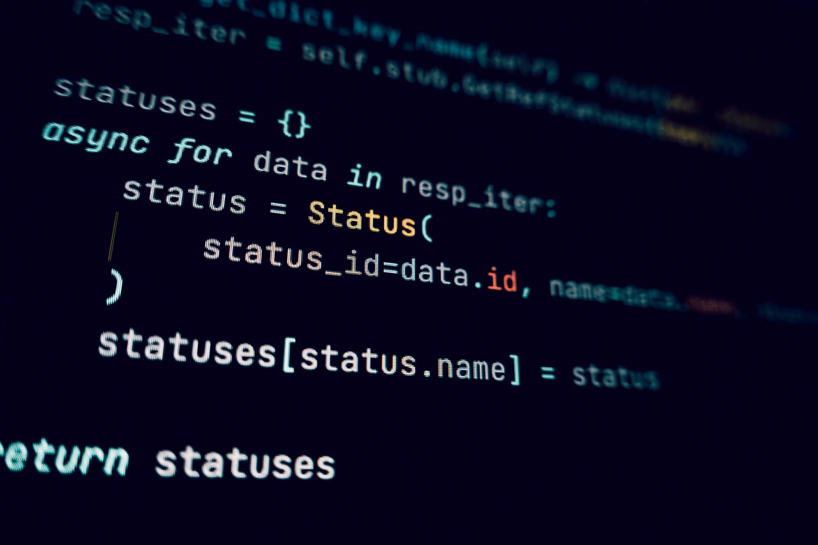 Detailed view of programming code in a dark theme on a computer screen