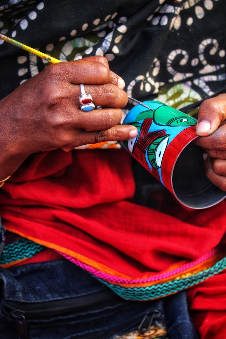 Woman Painting A Cup 