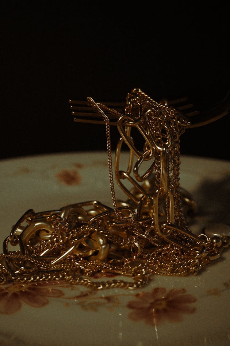 Gold Jewelries On The Plate