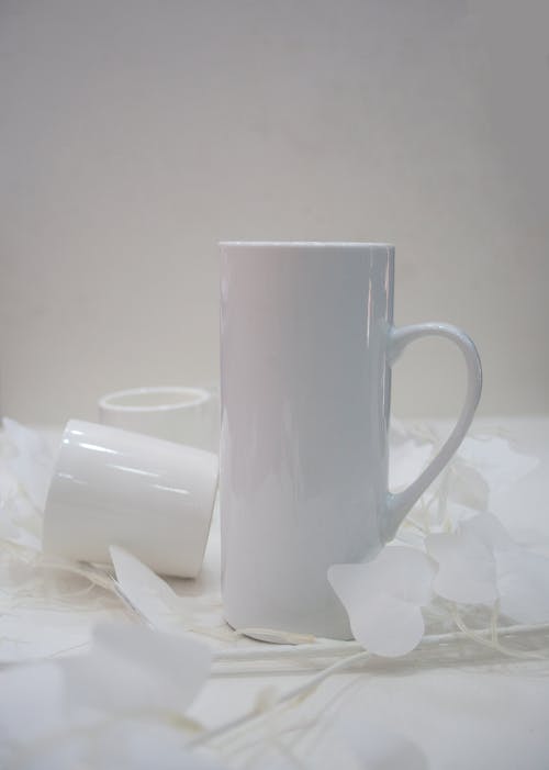 White Ceramic Mug on White Table