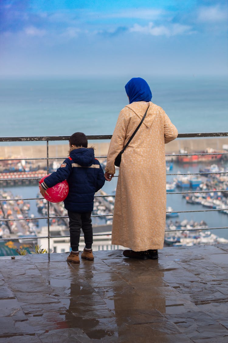 Woman With Little Son Looking At Marina 