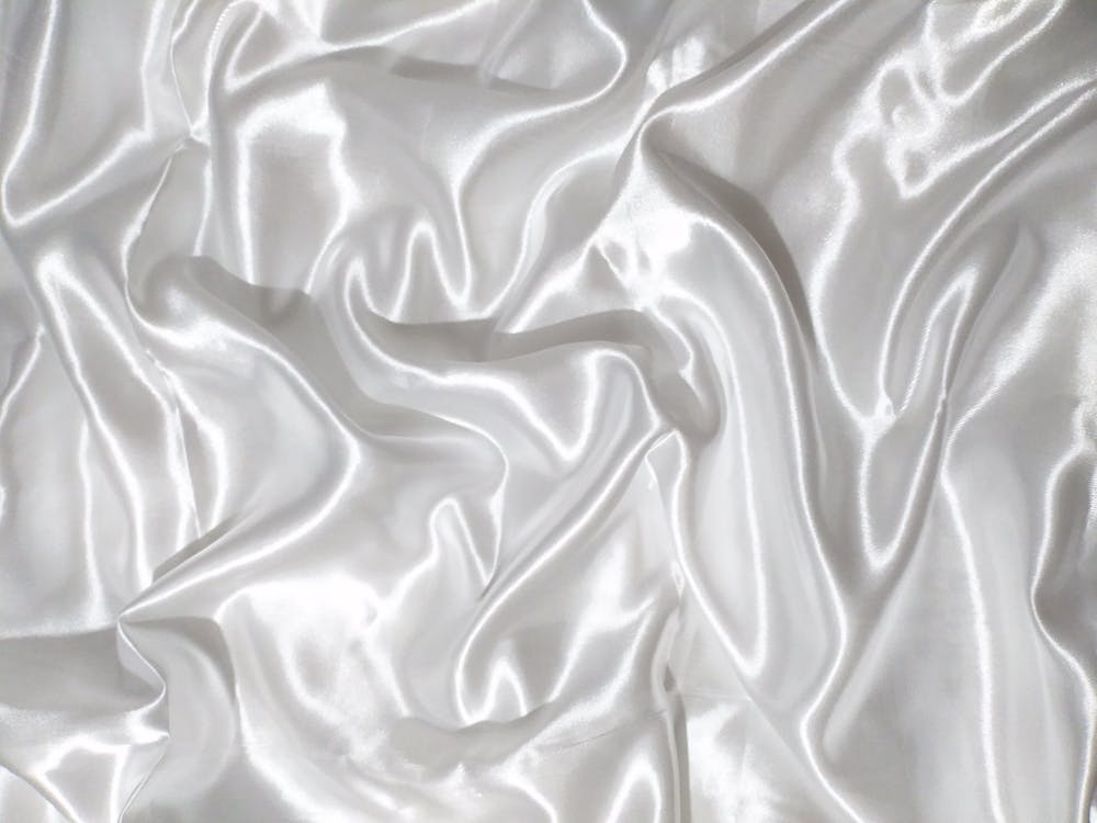 Close-Up Shot of a White Silk Textile