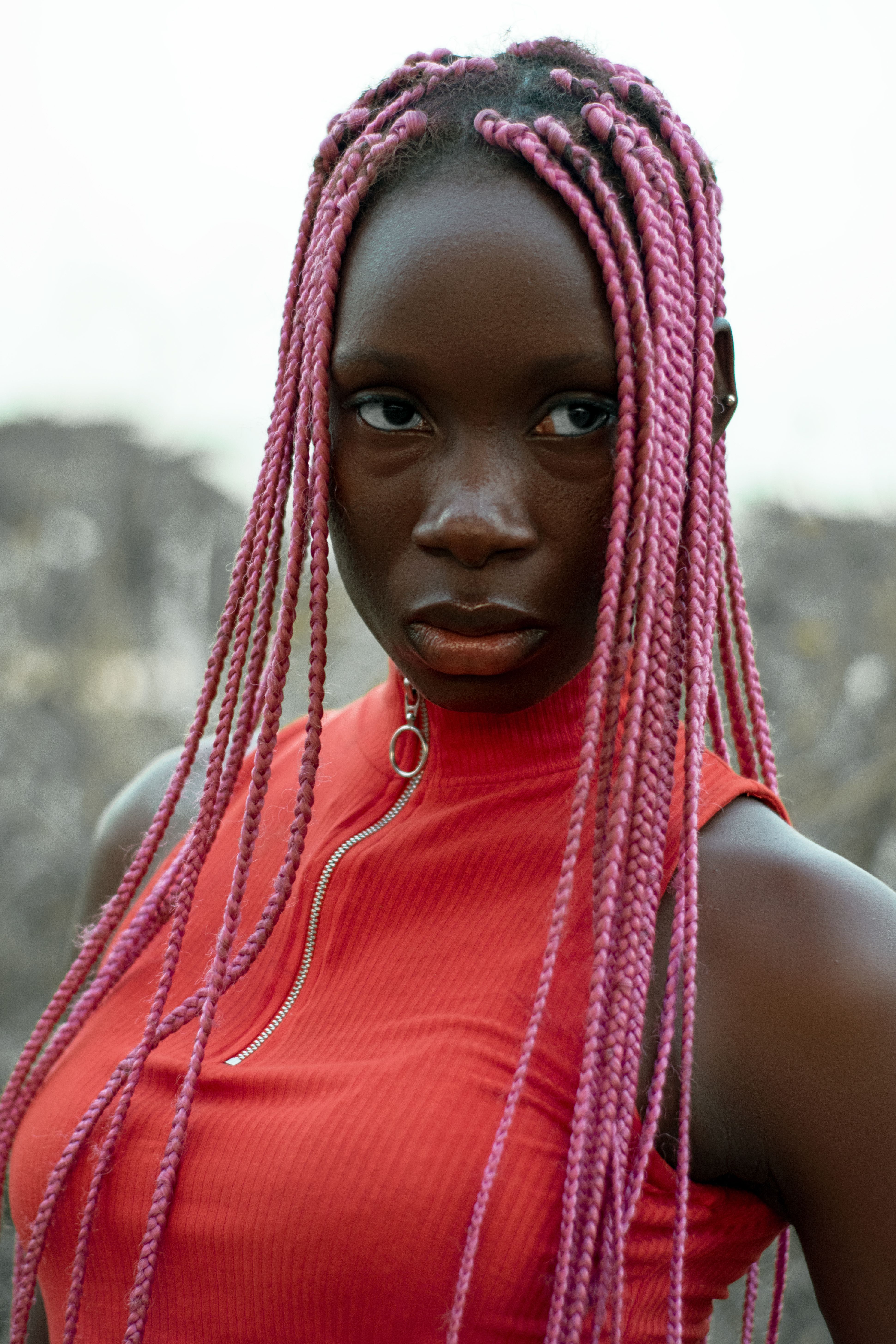 A Close-Up Shot of a Woman with Braided Hair · Free Stock Photo