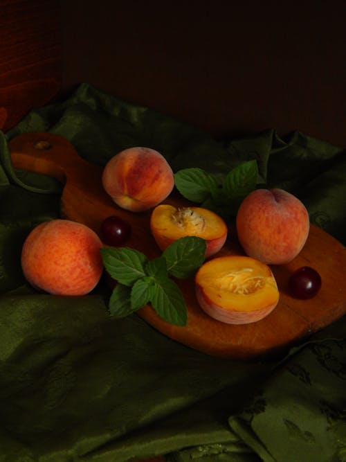 Fresh Peaches on a Cutting Board 