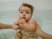 Baby in Bathtub With Water