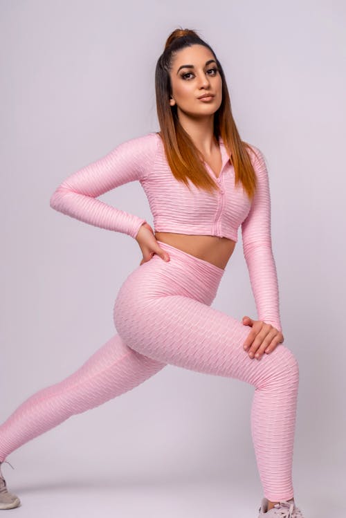 Woman in Pink Long Sleeve Shirt and Pink Leggings