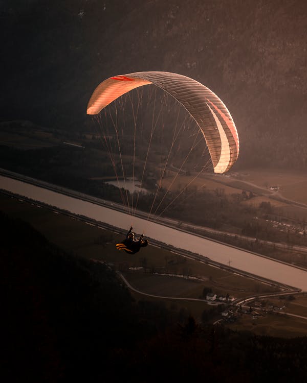 Free Photo of a Person Paragliding Stock Photo