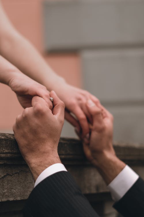 Close up of Man and Woman Holding Hands · Free Stock Photo