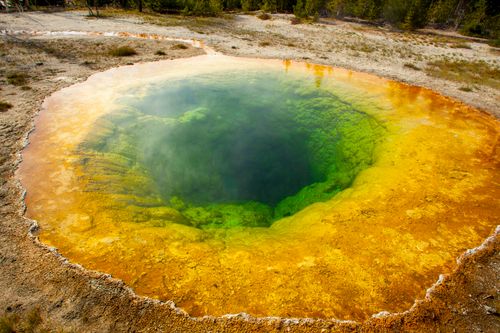 Free Vivid geothermal hot spring at Yellowstone, showcasing colorful mineral deposits and water. Stock Photo