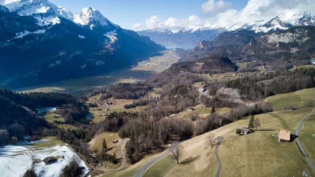 A breathtaking aerial view of Hasliberg, Switzerland, showcasing the scenic alpine landscape and snow-capped mountains.