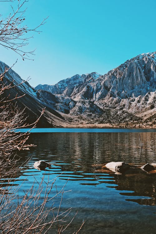 Free Scenic View of a Mountain near the Lake Stock Photo