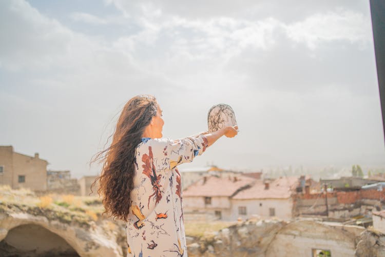 Woman With Old Historic Town In Background