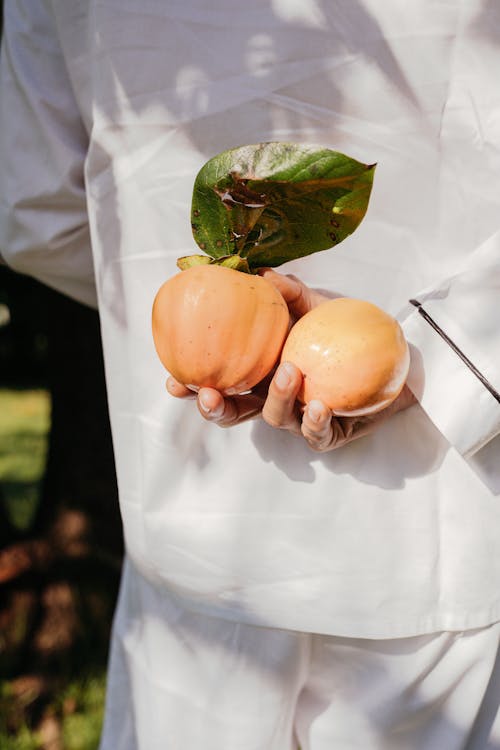 Hand Hiding Vegetables behind Back