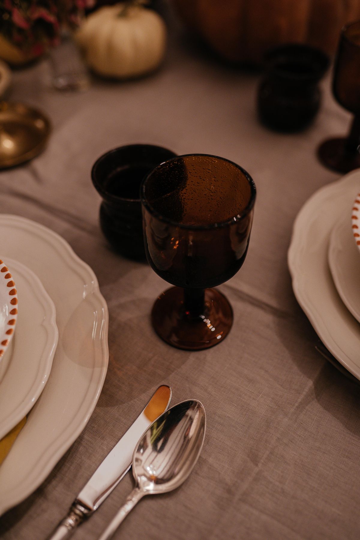 Autumn table with amber glasses and elegant tableware