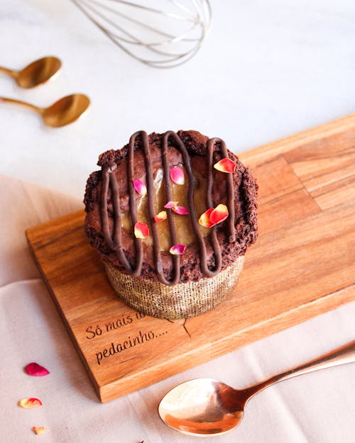 Free Close-Up Shot of a Chocolate Cupcake on a Wooden Tray Stock Photo